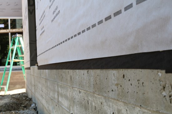 ... or Siga’s Wigluv-black, after applying a primer on the concrete.