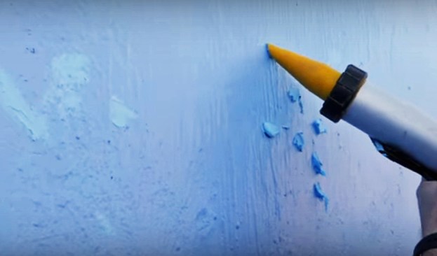 The crew uses 2200 sealant to fill in any holes or places with incomplete coverage.