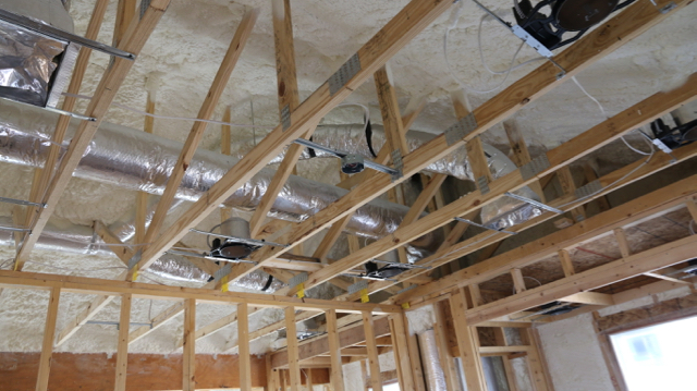 Open Cell spray foam applied 9″ deep at the roof allows all the ducting to run through the conditioned envelope of the house. This is HUGE for the South. Do NOT run ducts outside your insulation layer…it’s not smart.