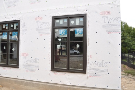 Windows have Flexwrap Sill Pans and Straighflash Jambs/head.  Use DuPont’s methods for setting a window and you’ll be using the best possible method to ensure a leak-free window.  Notice the Plastic cap staples hold really well.  I like the Stinger Cap stapler and Cap/Staple packs.  They work great!