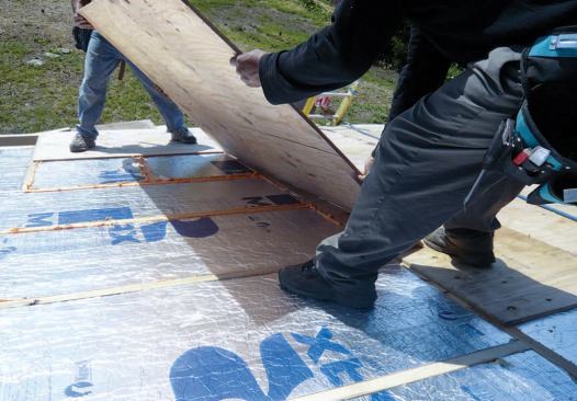 A second layer of 1/2-inch plywood was installed over the sleepers in a bead of spray foam.
