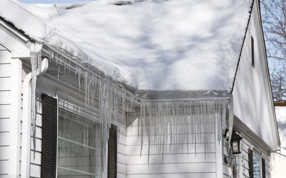 Ice dams form on cold days when heat leaking from inside the home warms the attic enough to melt the snow on the roof.