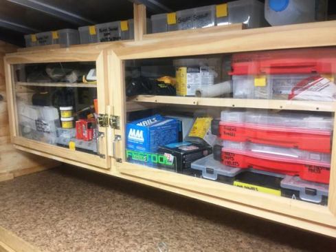 The cabinet above the counter contains a selection of fasteners, hardware, and supplies—many of which are housed in compartmentalized organizers.