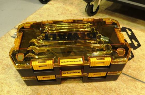 This is an interesting setup for mechanics tools. Various groups of tools (“Stackable Sets”) are contained within modular storage boxes that clip one to another. Instead of hauling a complete set of mechanics tools, you can take specific groups of tools for specific jobs. The plastic sticking out to the right is removable; it’s there to hang the box on a display rack at a store.