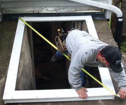 Attaching the Cap: I positioned the cap, squared it up, and prepared to screw it to the frame.