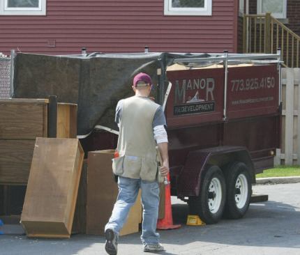Anything that couldn't be reused was thrown into the author's dump trailer and towed away to a local transfer station.