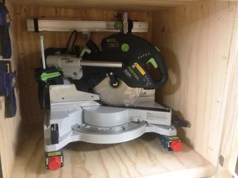 This Kapex is one of two miter saws stored in the trailer; the other’s a DeWalt. Both tools are fastened to brackets that allow them to be quickly attached and detached from a Bosch Gravity Rise Stand. A taller compartment directly below holds a Bosch table saw on a second Gravity Rise Stand.
