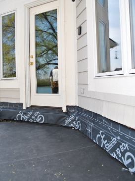 The deck ledger is flashed with Ice & Water Shield.