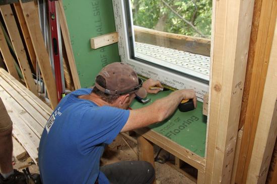 Centering the window in the opening.