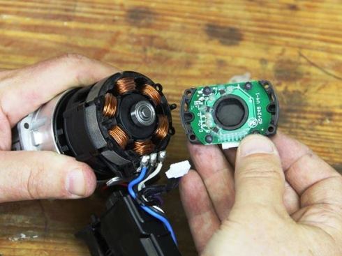 Pull controller off the bearing on the back of the rotor (the rotor is the part of the motor that spins).