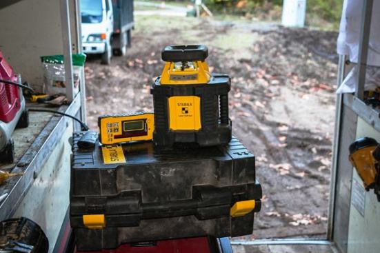 For shooting level, we use a 
Stabila LAR250 self- leveling rotary laser with a detector and a remote. We use it to shoot our foundations in level, find dirt grade, and establish control points. We can also use this level on its side to shoot square layout and adjust it using the remote. This is a rugged, high-quality product.