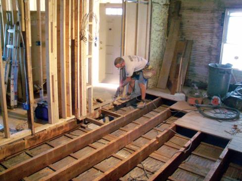 Where the boards ended at a wall, removal was fast and simple. But where the boards continued under an interior wall, I made an initial cut about 6 inches from the wall, which let me quickly remove most of each board. Then using a reciprocating saw, I cut back the remaining stubs flush with the wall framing.