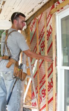 Battens ripped from 3/8-inch plywood were fastened through the foam and sheathing into the wall framing to provide solid nailing for the fiber-cement siding and create a drying airspace behind it.