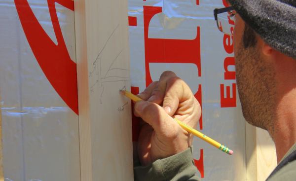The team's theoretical eave trim solution, defined by the full scale mockup model, didn't quite correlate to the reality the carpenters discovered as they worked around the house and confronted the old roof system's out-of-whack hundred-year-old framing. Here, Pollard sketches out a modified version of the trim design that's tweaked to fit the real situation.