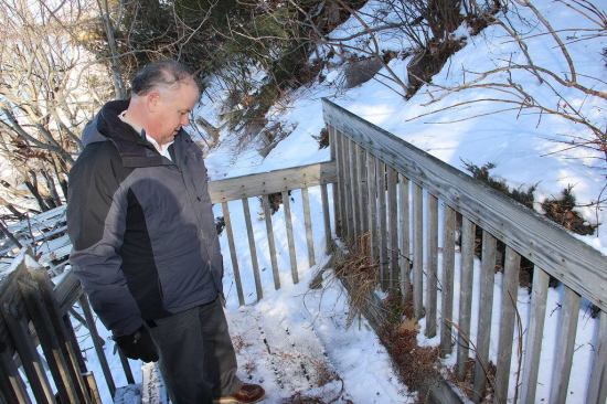 Third-generation wood treater Hal Bumby of Maine Wood Treaters looks at a decades-old treated wood structure on the shore of Sebago Lake in Maine. This deck and staircase, built with CCA (chromated copper arsenate) lumber, is still sound after many years of exposure to weather and ground contact. But newer types of decking and framing lumber would not be warrantied in the same application — not because of a less effective formula, but because of a lower required dose of the treating chemicals. Bumby advocates returning to a policy of ground-contact treatment for all treated lumber: “One product, suitable for all applications.”