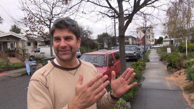 Architect and contractor Andrew James Gregor on the sidewalk in Berkeley, California, in front of his current remodeling project. The clients had the choice of building out into the back lot or building a new second story on the house. “We opted to build upwards,” says Gregor.