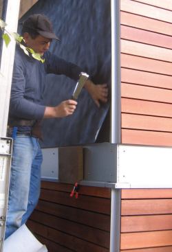 With narrow siding, such as these 4-inch cedar boards, two full layers of underlayment were required for UV protection.