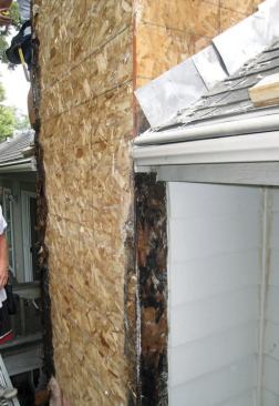 We found that most of the damage had been caused by water from the roof running behind the siding and down the sheathing — the result of some missing step flashings.