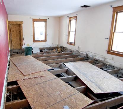 The exposed foundation and floor framing. Ductwork, wiring, bathroom fixtures, and plumbing also had to be pulled.