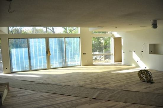 We install hardwood floors shortly after sheet rock is completed.