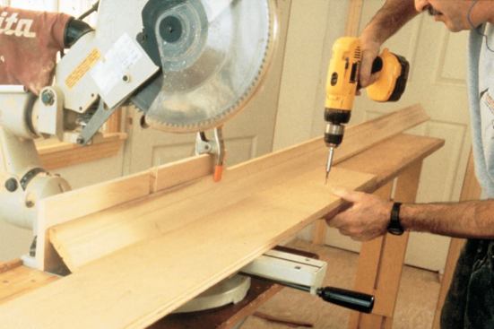 Install a stop along the length of your saw base to stabilize crown molding when cutting in position.