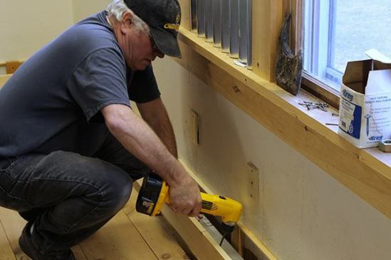 To attach the face board of the covers to the base blocks, pocket screw holes were pre-drilled and the screws were driven using an extended bit with a right angle drill.