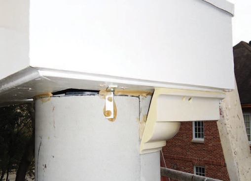 At the top, the column is finished with a polyurethane foam capital, which we screwed to the soffit and glued together and to the column with PL-400 construction adhesive.