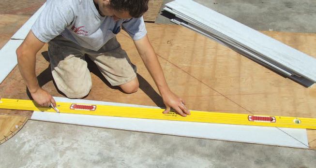 Then I set each board on the full-scale layout to scribe the cut line.