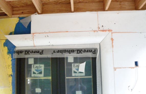 After the foam has been glued to the walls, all of the gaps between panels are filled with spray foam.