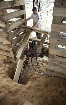 Space between the cribbing stacks was too tight to use the drag bar; there, the crew struggled to brace the frame against the cribbing without toppling the stacks.