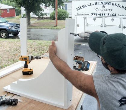 We predrilled holes for attaching to the house, then glued and screwed the brackets to the corner pieces.