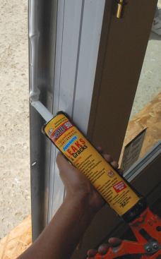 Nailing fins get a continuous bead of sealant before installation.