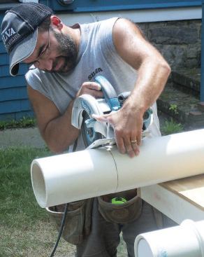 A carbide blade in a circular saw was used to trim the bottom ends of the columns to length.