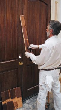 He blended different stain colors together to find the combination that would most closely match the color of the stained and seal-coated mahogany entry doors.