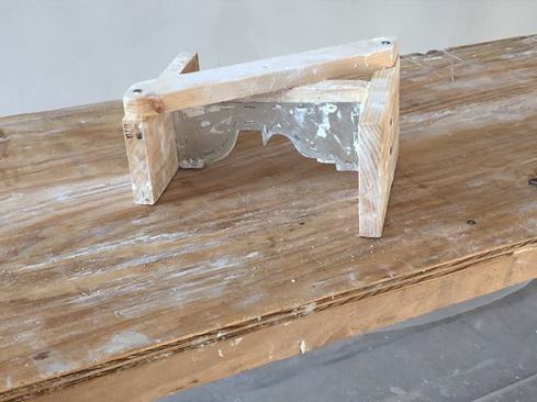 ... or he works by hand, extruding the plaster with a knife cut to match existing crown profile. He does this extrusion work on an 18-inch-wide by 6-foot-long table.