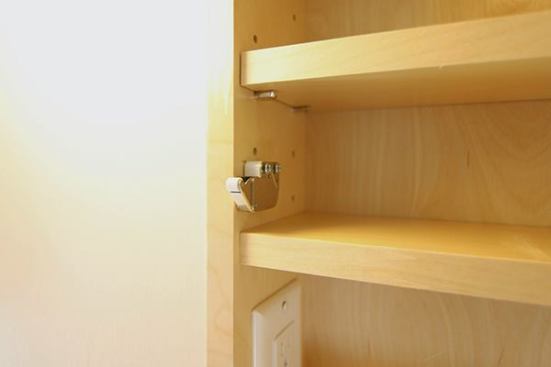 JR Products Touch latch. I also really like the outlet inside the med cabinet to hide an electric toothbrush.
