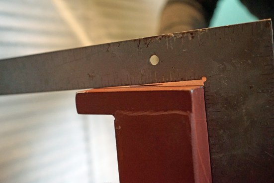 Note how the bracket was purposefully fabricated out-of-square to accommodate the out-of-plumb column.