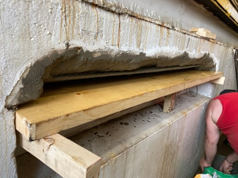 The form in this case is simple—a single 2x8 braced against the top edge of the concrete lighting niche.