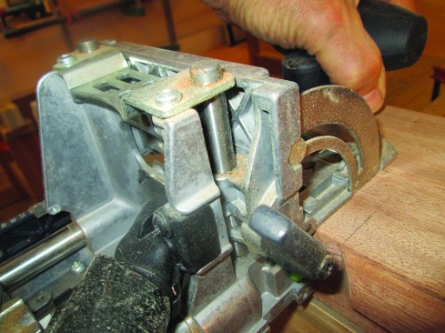Once the jack miters are cut, use the Domino joiner to cut two mortises in the end grain of all the rails and in each shoulder on the stiles. The outside mortises on the shoulders that meet the top and bottom rails are cut “normal”—that is, the joiner registers on the flat part of the shoulder.