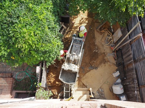 Inner-city access is often tight so concrete must be “walked” in through alleys and backyards.