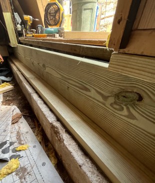 The rim joist flipped up with the ice-barrier membrane facing the outside.