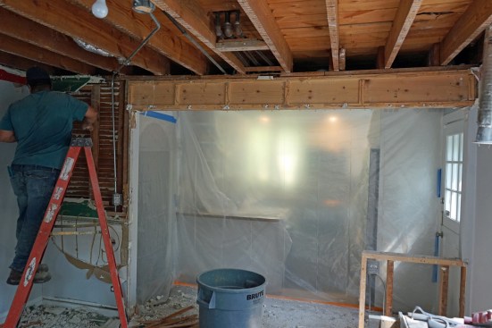 The span and width of this opening requires a double-LVL beam, but in a previous renovation o open up the room to the kitchen, remodelers had only used a double 2x12.