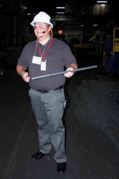 Sixth-generation family employee Ryan DeArment holds a billet of C1080 alloy steel where all Channellock tools get their start.