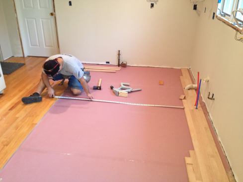 It's a good idea to measure across at several points while putting in the new floor to ensure that the boards are still going in straight and parallel.