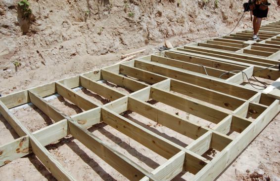 The poured footing simplifies the process of snapping layout lines and provides a convenient surface for marking plates and assembling wall framing.