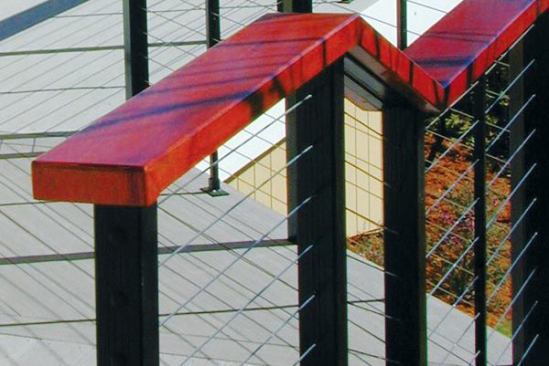 A 36-inch high guardrail with 11 cables can have a total tension of 2,640 lbs. on each end post, each of which has to be able to support that load with little or no deflection. If the deck has wood posts, a small amount of wood movement can cause the cable too sag.