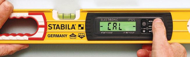 The display is typically calibrated by holding the level against a vertical surface, leveling it visually with the center vial, and then pressing the CAL button twice.