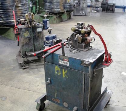 Wire drawing is a continuous process. To avoid having to thread the end of each new coil of wire through all of the machinery you just saw, the beginning of the new coil is welded onto the end of the one before it using one of these electric welding machines.