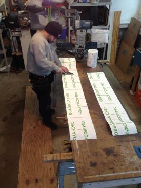 With a number of windows to install, it’s faster to cut duplicate lengths of tape, enough to cover every opening.