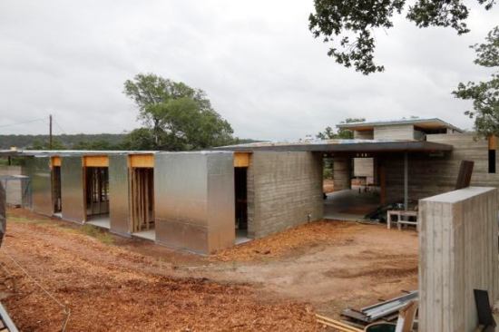 High Exposure house with No Overhangs demands a robust HouseWrap (WRB) The silver walls in this photo are Polyguard's Aluma Flash.